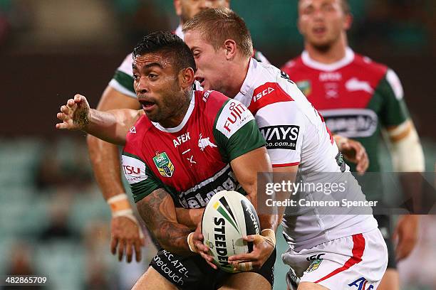 Nathan Merritt of the Rabbitohs passes the ball during the round five NRL match between the St George Illawarra Dragons and the South Sydney...