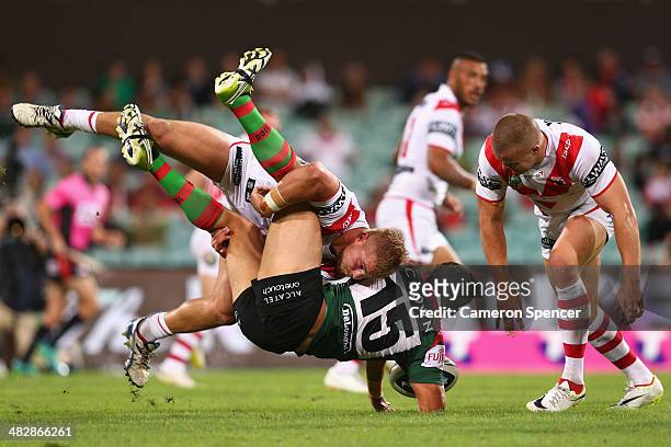 Kyle Turner of the Rabbitohs is tackled by Jack de Belin of the Dragons during the round five NRL match between the St George Illawarra Dragons and...