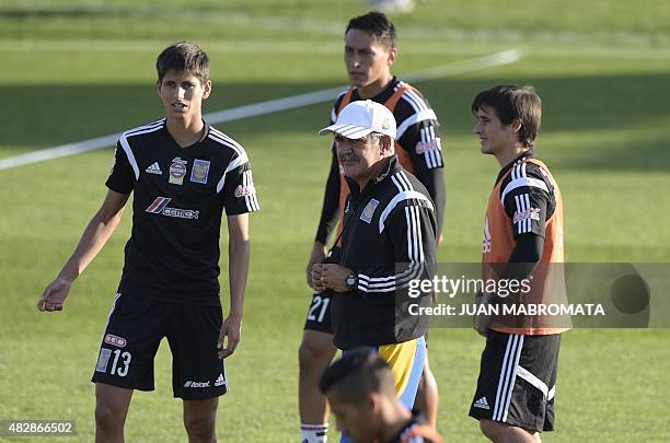 Mexico's Tigres coach Ricardo Ferretti gestures amidst some of his footballers during a training session at the Boca Juniors training field in Buenos...