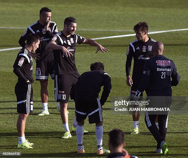 Mexico's Tigres forward Andre Gignac gestures amidst teammates during a training session at the Boca Juniors training field in Buenos Aires,...