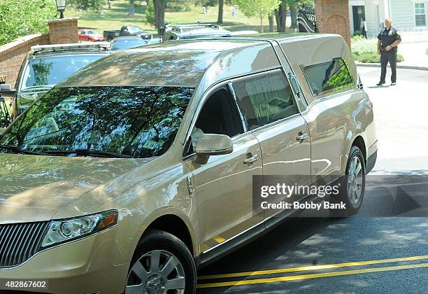 The Wingham Funeral Home hearse leaves Fairview Cemetery that was carrying the body of Bobbi Kristina Brown at Fairview Cemetery on August 3, 2015 in...