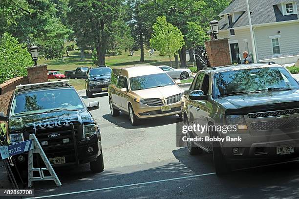 The Wingham Funeral Home hearse leaves Fairview Cemetery that was carrying the body of Bobbi Kristina Brown at Fairview Cemetery on August 3, 2015 in...