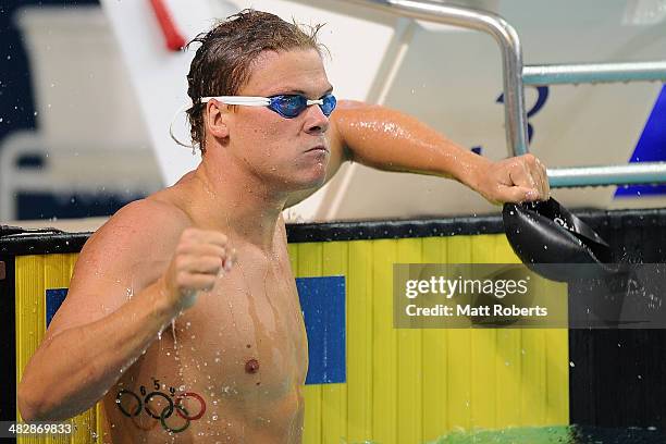 Christopher Wright celebrates winning the final of the Mens 100 metre Butterfly event during the 2014 Australian Swimming Championships at Brisbane...