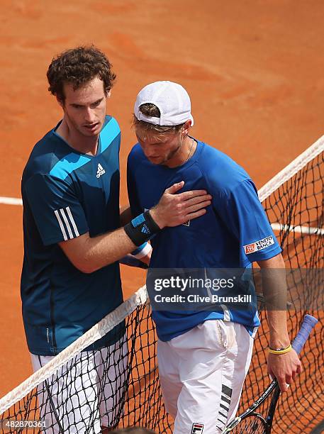 Andy Murray of Great Britain at the net after his straight sets victory over against Andreas Seppi of Italy in the second rubber during day two of...