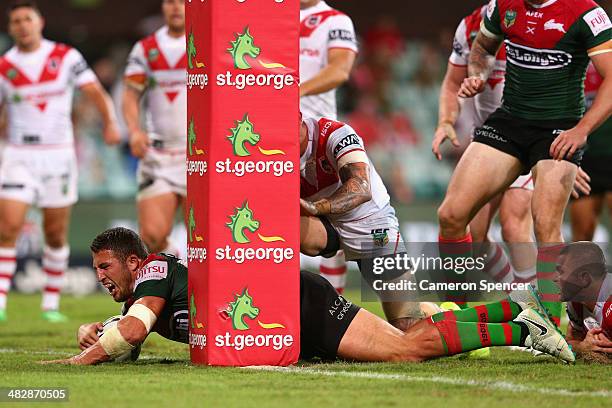 Sam Burgess of the Rabbitohs scores a try during the round five NRL match between the St George Illawarra Dragons and the South Sydney Rabbitohs at...