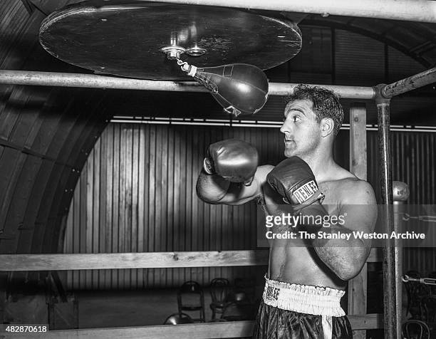 September 1955: Rocky Marciano poses for the camera while training for title defense against Archie Moore at the Grossingers training camp in...