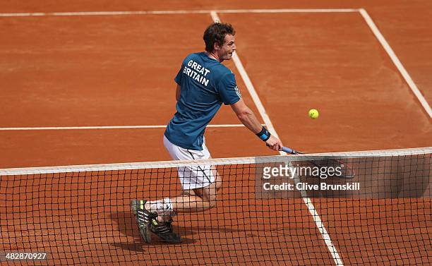 Andy Murray of Great Britain plays a backhand volley against Andreas Seppi of Italy during day two of the Davis Cup World Group Quarter Final match...