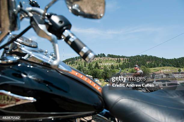 Biker rides past the Sturgis RV park on the first day of the annual Sturgis Motorcycle Rally August 3, 2015 in Sturgis, South Dakota. This year marks...