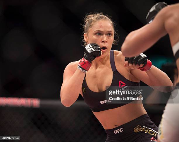 Women's bantamweight champion Ronda Rousey looks to attack opponent Bethe Correia of Brazil during the UFC 190 event inside HSBC Arena on August 1,...
