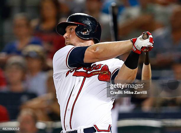 Chris Johnson of the Atlanta Braves hits a solo home run in the seventh inning during the game against the San Francisco Giants at Turner Field on...