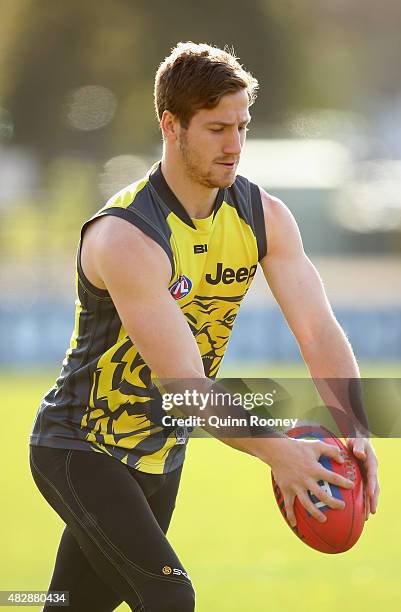 Kane Lambert of the Tigers kicks during a Richmond Tigers AFL training session at ME Bank Centre on August 4, 2015 in Melbourne, Australia.