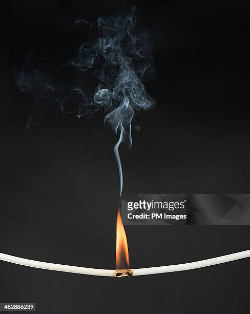 burning wire - cross fire stock pictures, royalty-free photos & images