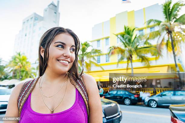 beautiful cuban american woman on south beach miami travel destination - miami architecture stock pictures, royalty-free photos & images