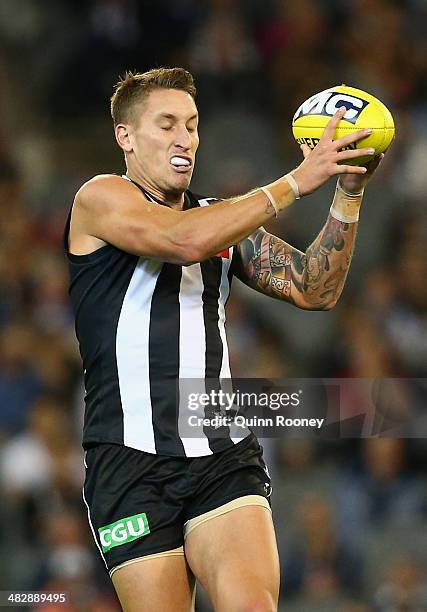 Jesse White of the Magpies marks during the round three AFL match between the Collingwood Magpies and the Carlton Blues at Melbourne Cricket Ground...