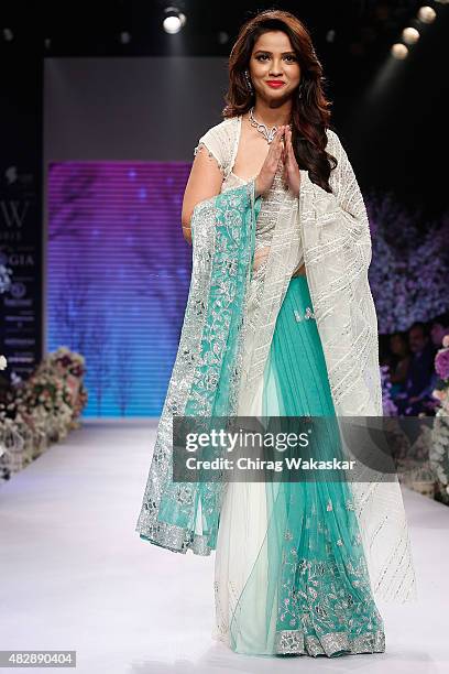 Adaa Khan walks the runway at the Beti show during Day 1 of the India International Jewellery Week at the Grand Hyatt on August 3, 2015 in Mumbai,...