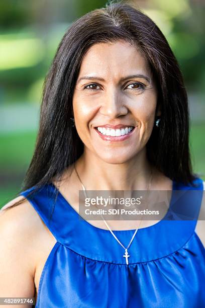 outdoor portrait of beautiful mature hispanic woman - necklace stock pictures, royalty-free photos & images