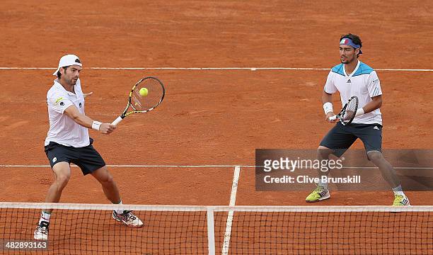 Simone Bolelli and Fabio Fognini of Italy in action against Andy Murray and Colin Fleming of Great Britain during day two of the Davis Cup World...