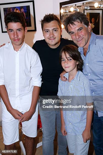 Humorist Jeff Panacloc pose Backstage with Tex and Tex's sons after the 'Jeff Panacloc perd le controle' show during the 31th Ramatuelle Festival :...