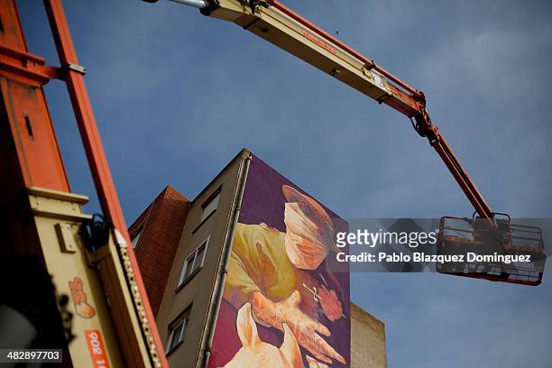 Chilean graffiti artist Inti paints a giant Don Quixote graffiti mural on a wall of a building on April 4, 2014 in Quintanar de la Orden, Spain....