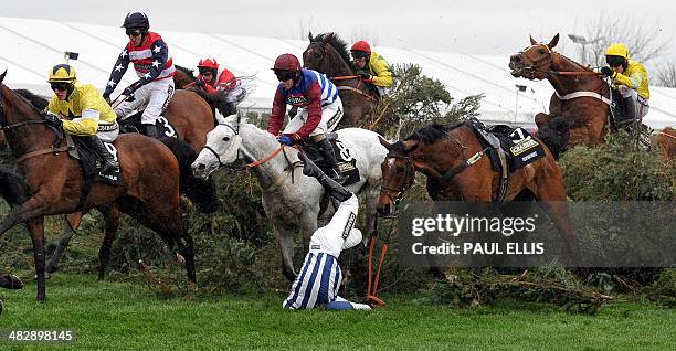 Teaforthree ridden by Nick Scholfield is unseated at The Chair during the Grand National horse race at Aintree Racecourse in Liverpool, north-west...