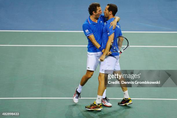 Julien Benneteau and Michael Llodra of France celebrate after winning their double match against Tobias Kamke and Andre Begemann of Germany during...