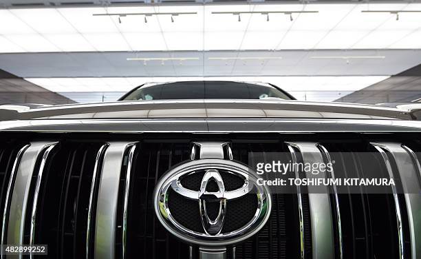 Toyota Motors' model Land Cruiser Prado is displayed at the company's Tokyo headquarters on August 4, 2015. Toyota on August 4 said its net profit...