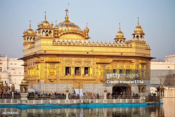 the golden temple in amritsar, india - golden temple india stock pictures, royalty-free photos & images