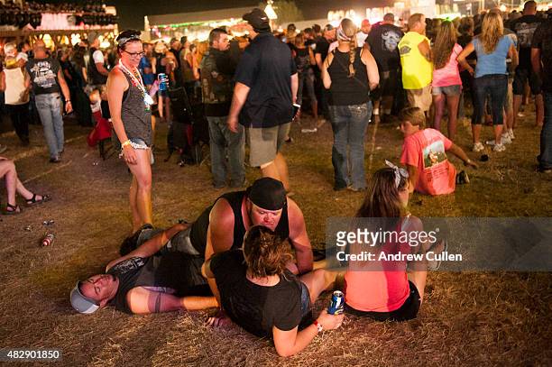 Revelers watch a concert at the Sturgis Buffalo Chip campground August 3, 2015 in Sturgis, South Dakota. This year marks the 75th anniversary of the...