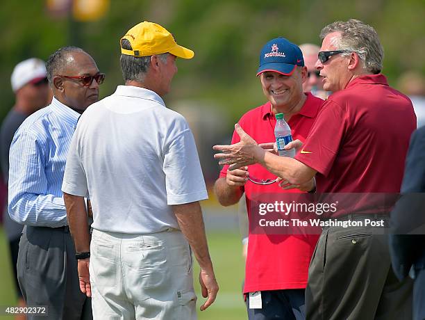 Richmond VA mayor Dwight C. Jones, left, Redskins president Bruce Allen, center left, University of Richmond football coach Danny Rocco, center...