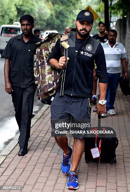 Indian cricketer Murali Vijay arrives for a net practice session at the National Cricket Club in Colombo on August 4, 2015. India will play three...