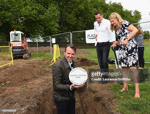 Former England Cricketers Graeme Swann and Simon Jones bury a time capsule at the construction site of the new Pavilion during the Field of Dreams...