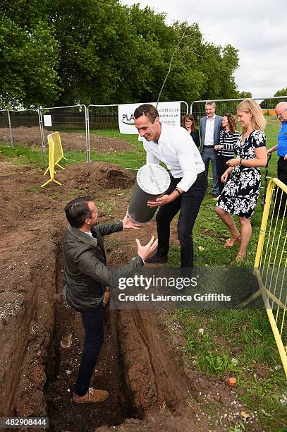 Former England Cricketers Graeme Swann and Simon Jones bury a time capsule at the construction site of the new Pavilion during the Field of Dreams...