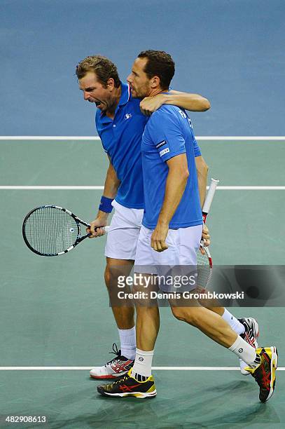 Julien Benneteau and Michael Llodra of France celebrate after winning their double match against Tobias Kamke and Andre Begemann of Germany during...