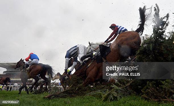 Teaforthree ridden by Nick Scholfield is unseated at The Chair during the Grand National horse race at Aintree Racecourse in Liverpool, north-west...