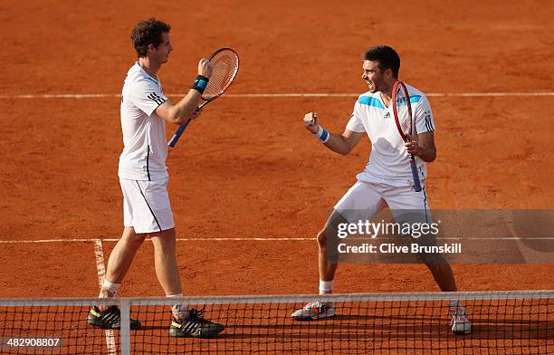 Andy Murray and Colin Fleming of Great Britain celebrate match point against Simone Bolelli and Fabio Fognini of Italy during day two of the Davis...