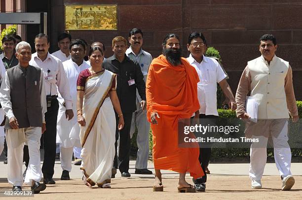 Yoga Guru Baba Ramdev with family members of freedom fighters addresses media persons after meeting with President of India Pranab Mukherjee to...