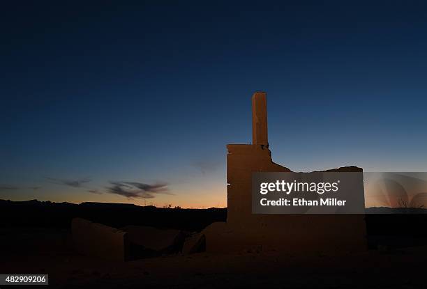 The ruins of the Hannig Ice Cream Parlor are shown at sunset in the ghost town of St. Thomas on August 3, 2015 in the Lake Mead National Recreation...
