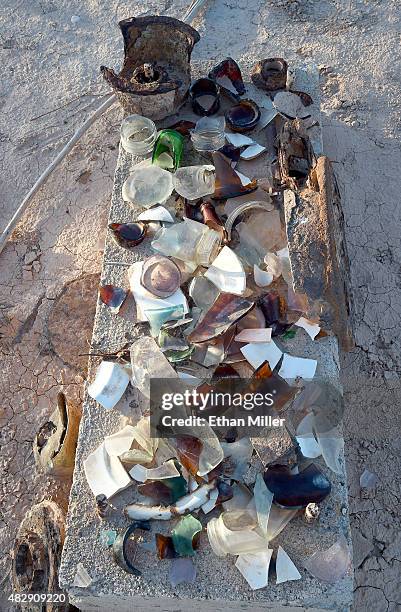 Pieces of broken glass, rusted metal and other artifacts are shown in the ghost town of St. Thomas on August 3, 2015 in the Lake Mead National...