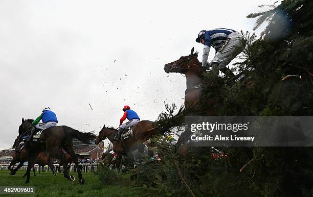 Teaforthree ridden by Nick Scholfield falls after jumping The Chair during the Crabbie's Grand National Steeple Chase at Aintree Racecourse on April...