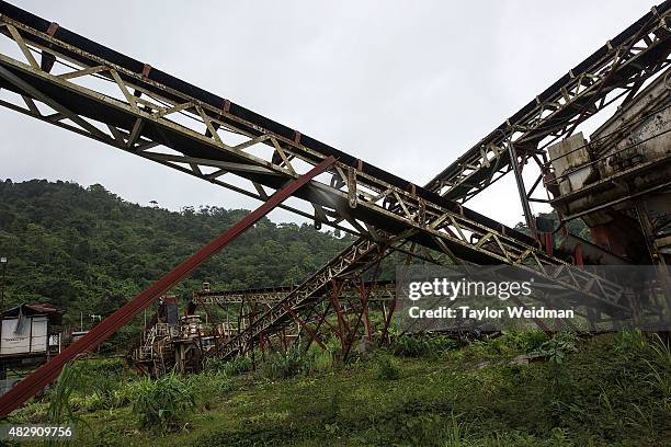 Idle machinery sits inside a rock quarry used for the construction of the planned Dawei SEZ on August 2, 2015 in Nabule, Myanmar. The controversial,...