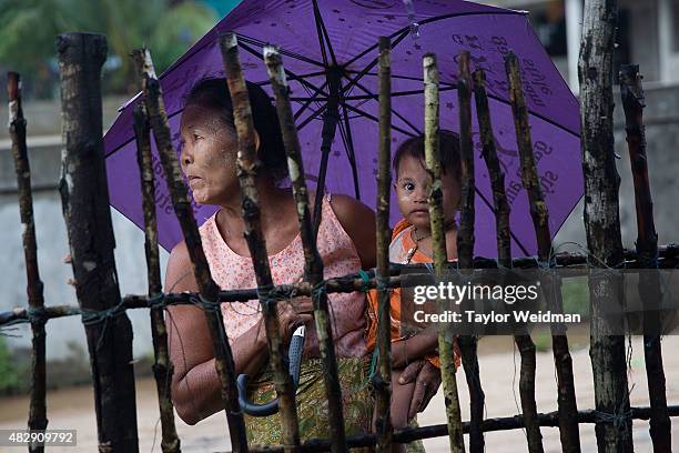 Burmese woman and her grandchild relax in a village near the planned Dawei SEZ on August 2, 2015 in Bawar Village, Myanmar. The controversial,...