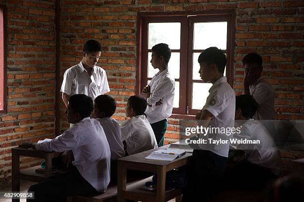 Students take part in an classroom exercise in a school inside the planned Dawei SEZ on August 3, 2015 in Mudu, Myanmar. The controversial,...