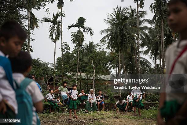 Burmese students take a break from classes in their village inside the planned Dawei SEZ on August 3, 2015 in Mudu, Myanmar. The controversial,...