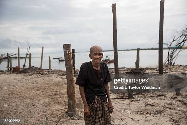 Retired fisherman poses for a portrait outside his home near the planned Dawei SEZ on August 3, 2015 in Pantininn, Myanmar. The controversial,...