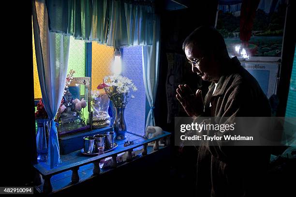 Retired government worker prays at a shrine in his home near the Dawei SEZ on August 4, 2015 in Pantininn, Myanmar. The controversial, multi-billion...