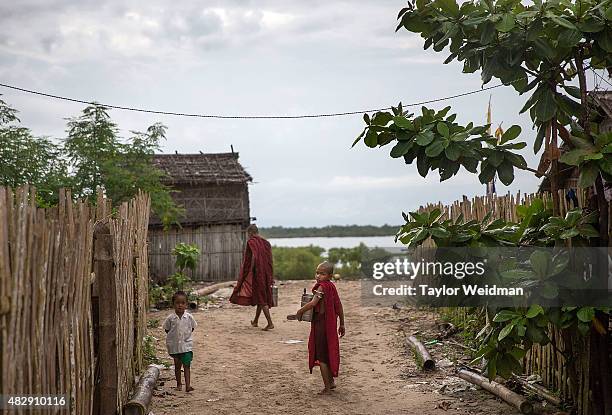 Young Burmese monk walks through his village near the planned Dawei SEZ on August 3, 2015 in Pantininn, Myanmar. The controversial, multi-billion...