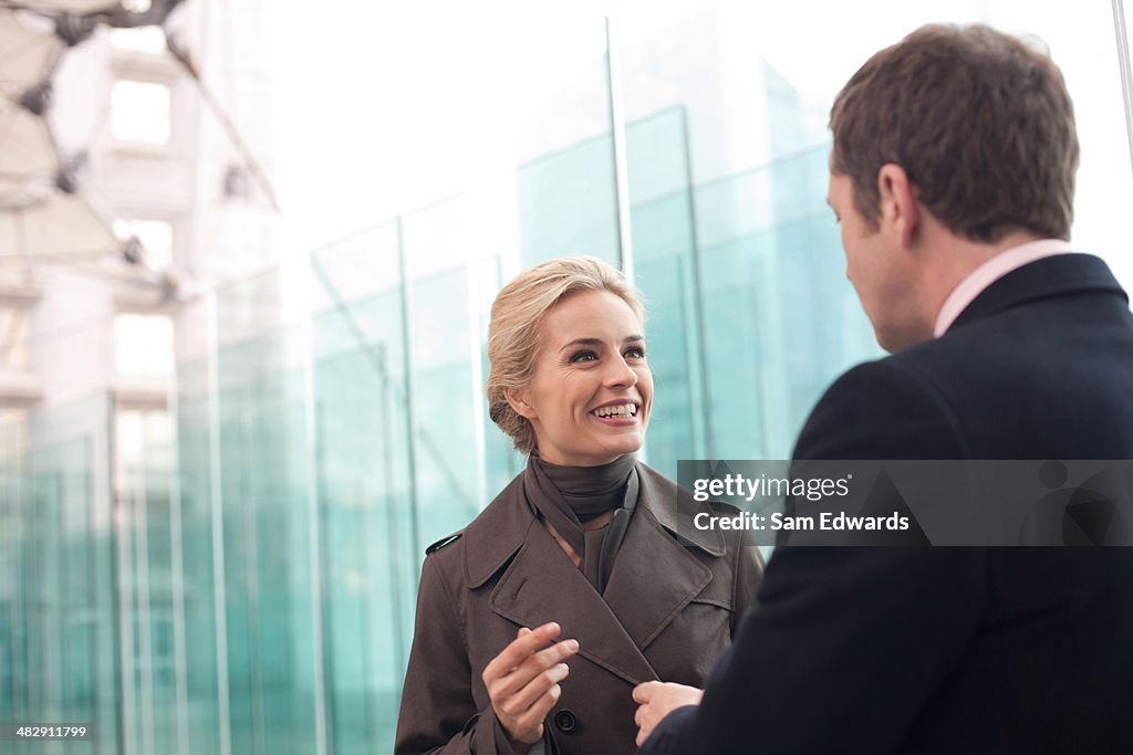 Two businesspeople outdoors talking