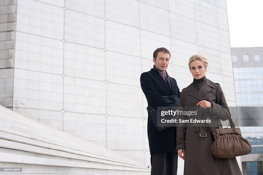 Two businesspeople outdoors on staircase