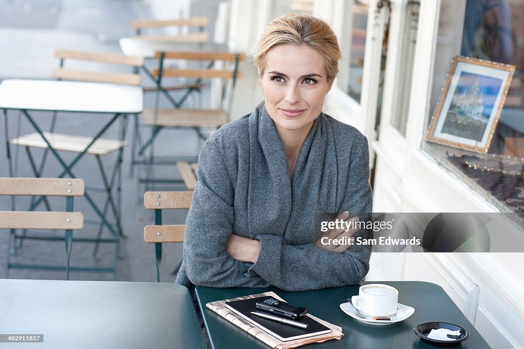 Woman on outdoor patio with coffee
