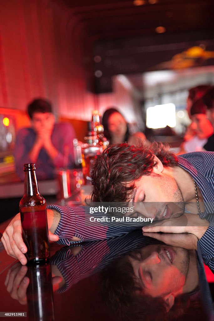 Man passed out on bar in nightclub